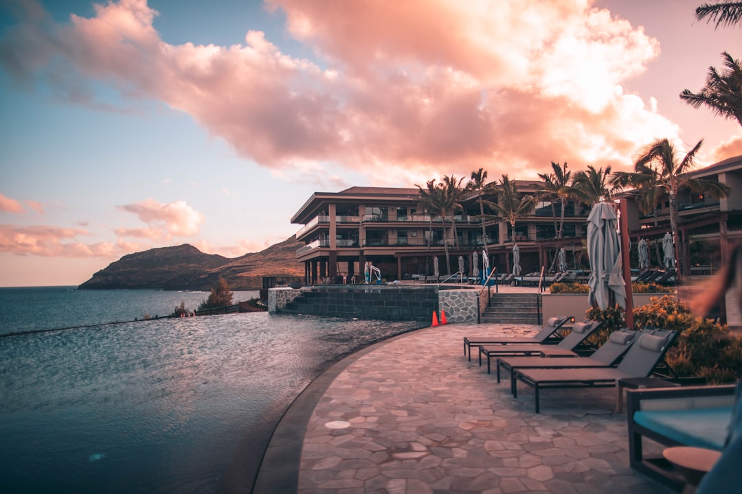 Luxury hotel swimming pool with lounge chairs